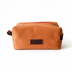 Brown toiletry bag with a visible brand logo on a white background