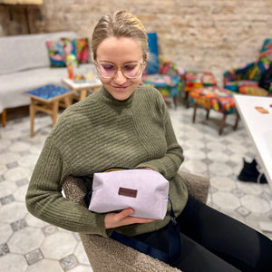 workshop participants with toiletry bags