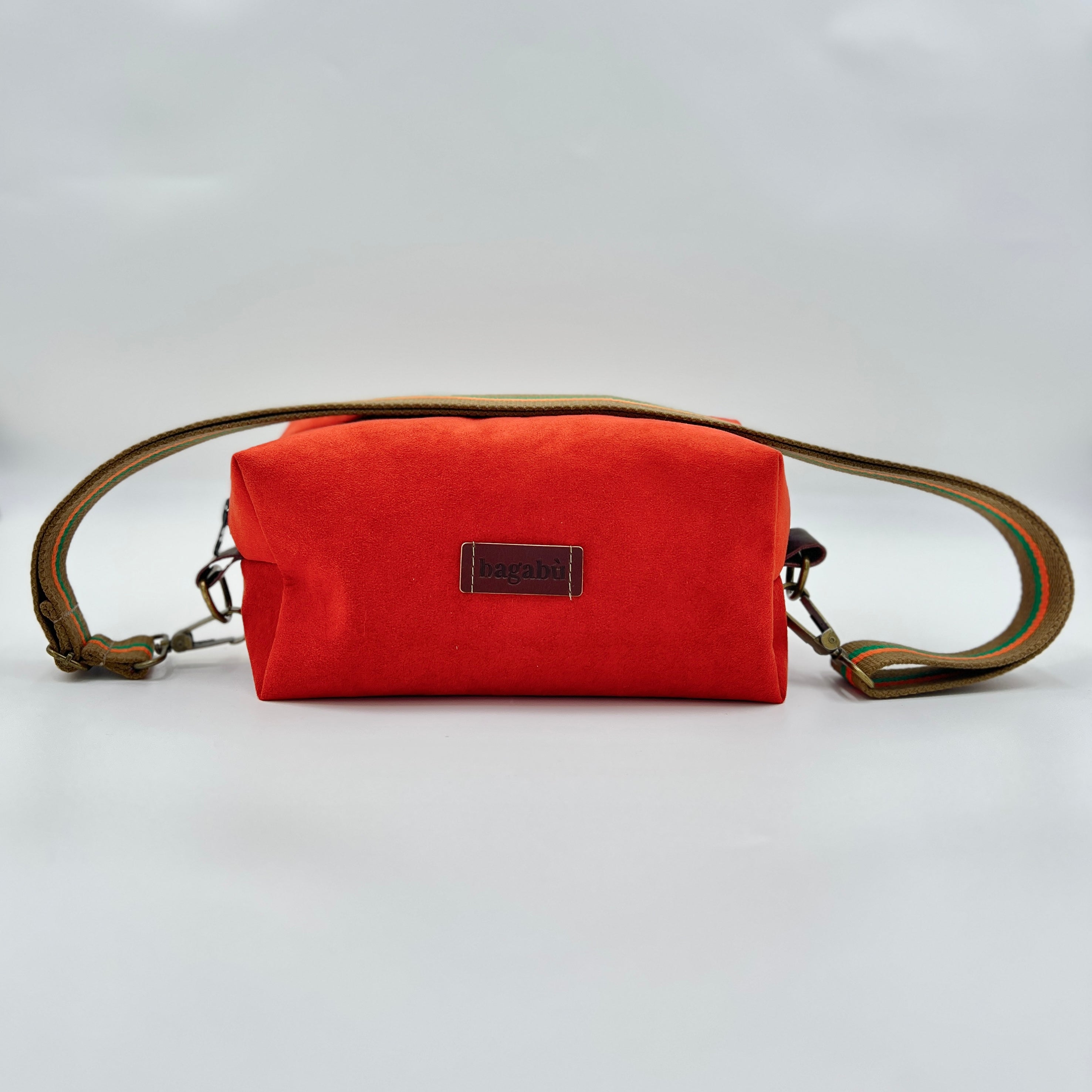 Red pouch with a brown strap on a white background