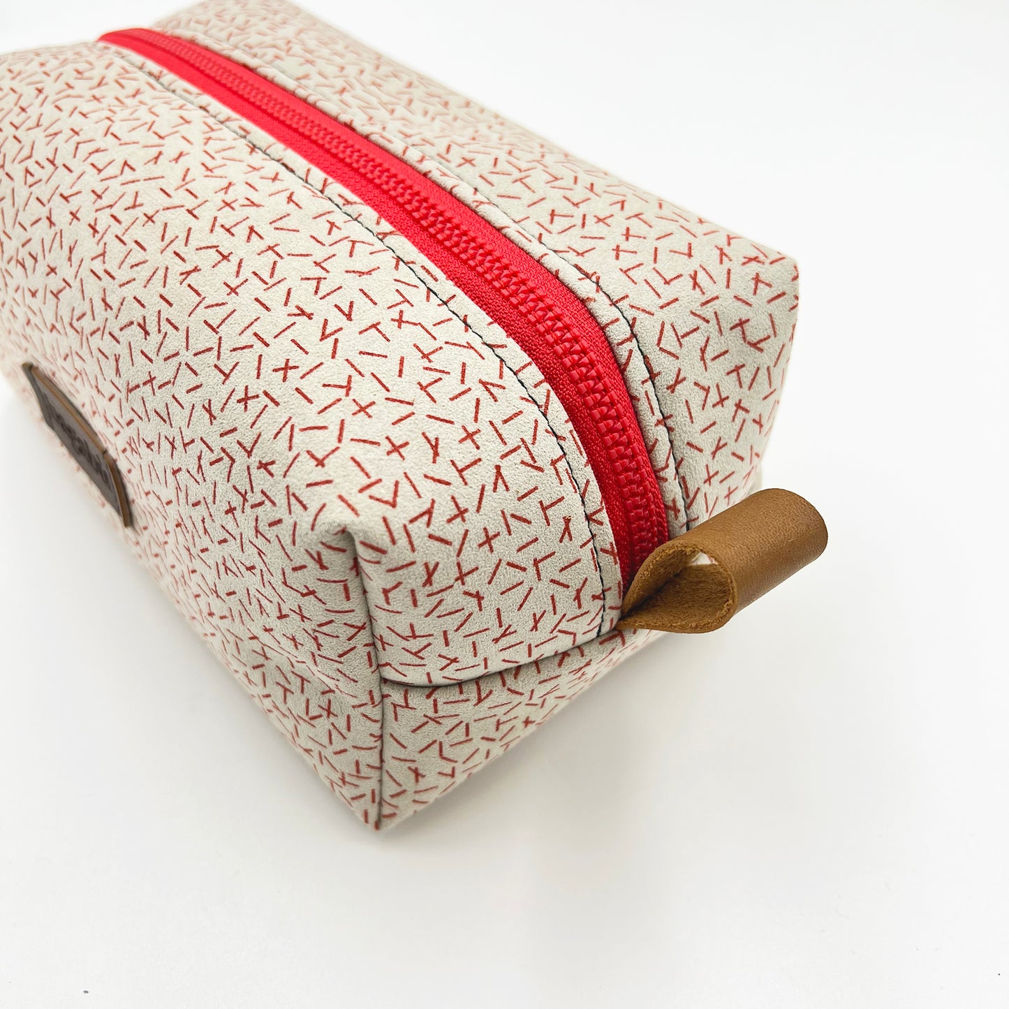 white and red toiletry bag