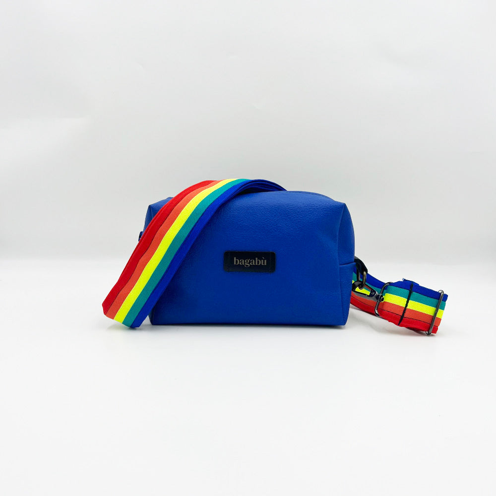 A blue leather shoulder bag with a multicolored striped strap, displayed against a white background.
