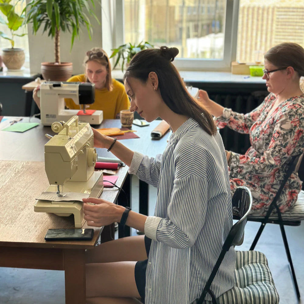 beginner workshop person using a sewing machine
