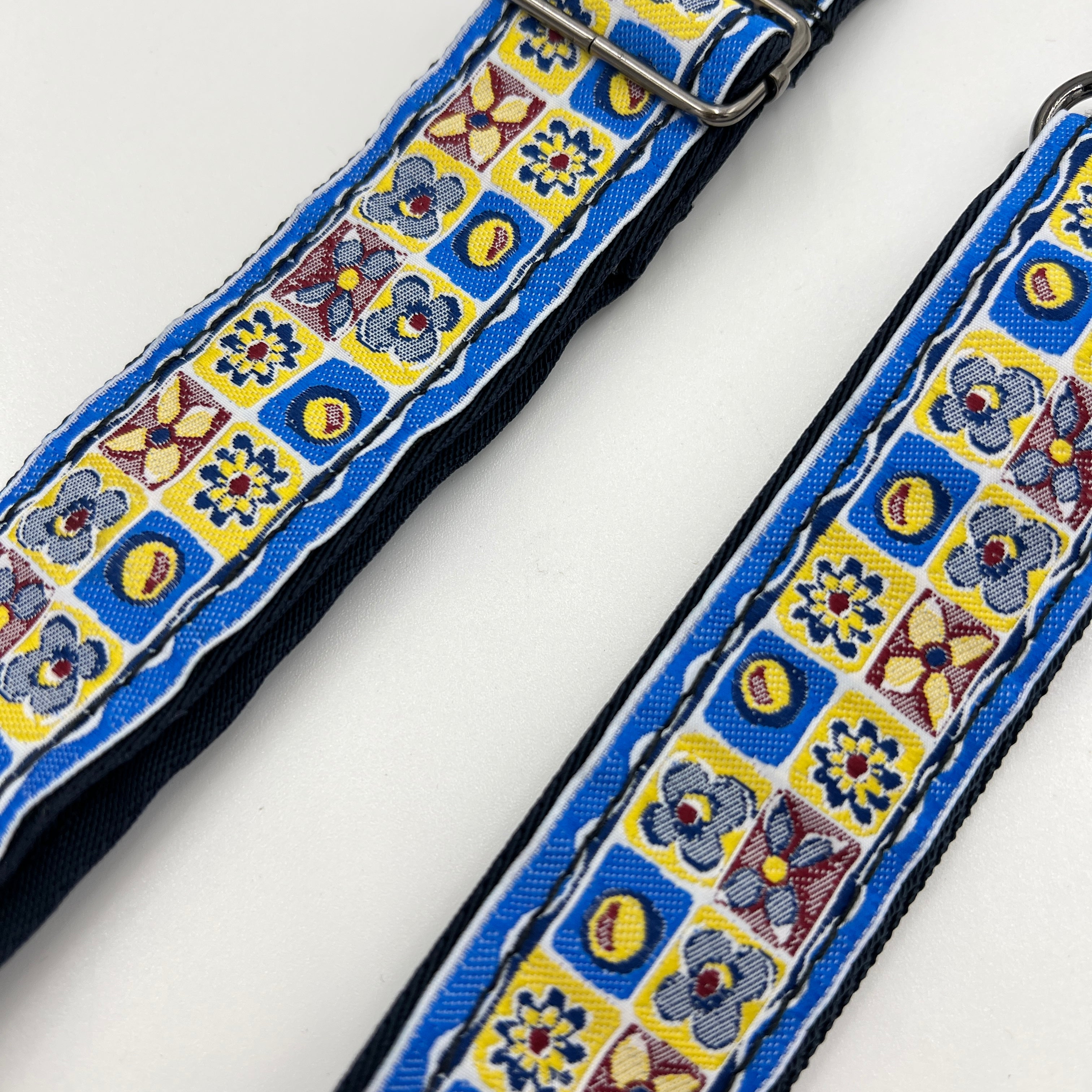 Colorful floral patterned strap on a white background