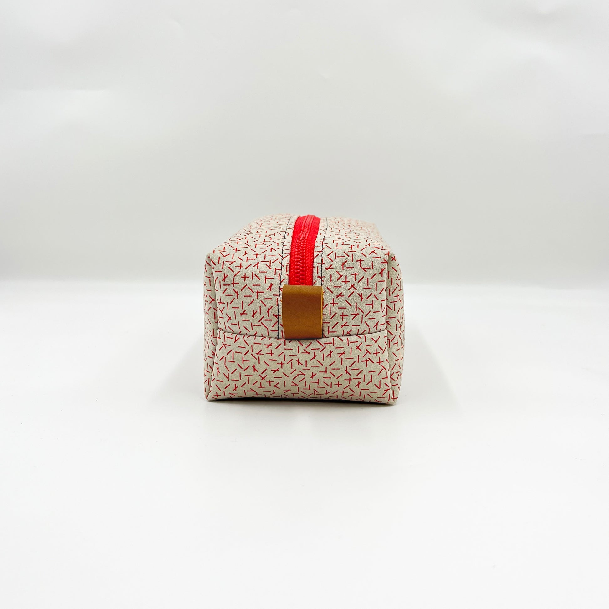 white and red toiletry bag