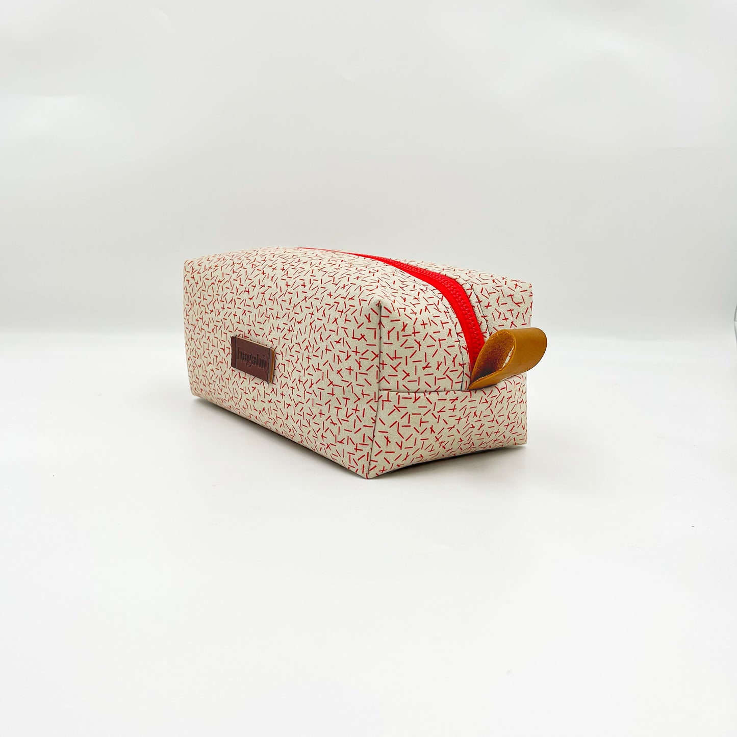 white and red toiletry bag