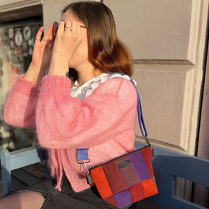 purple and red patch bag