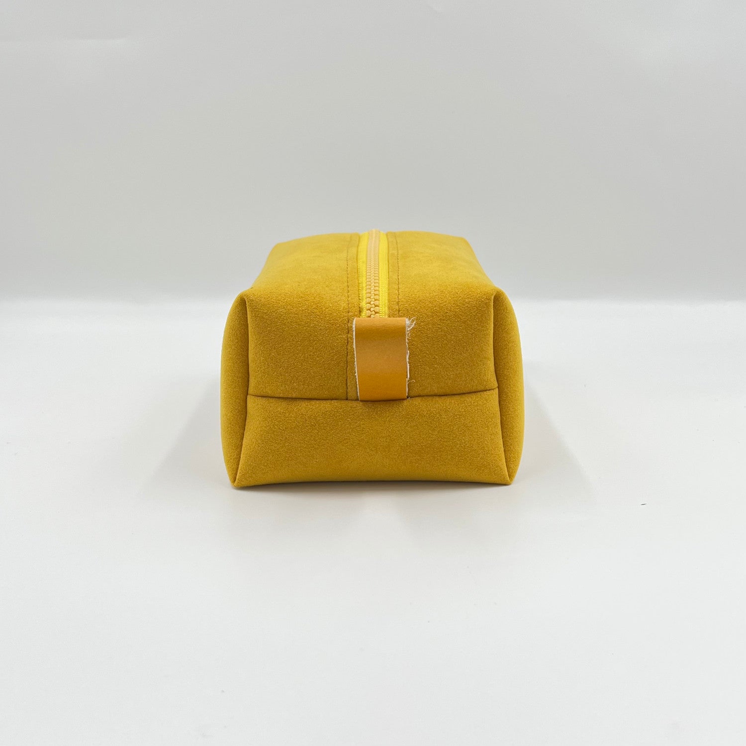 yellow alcantara toiletry bag