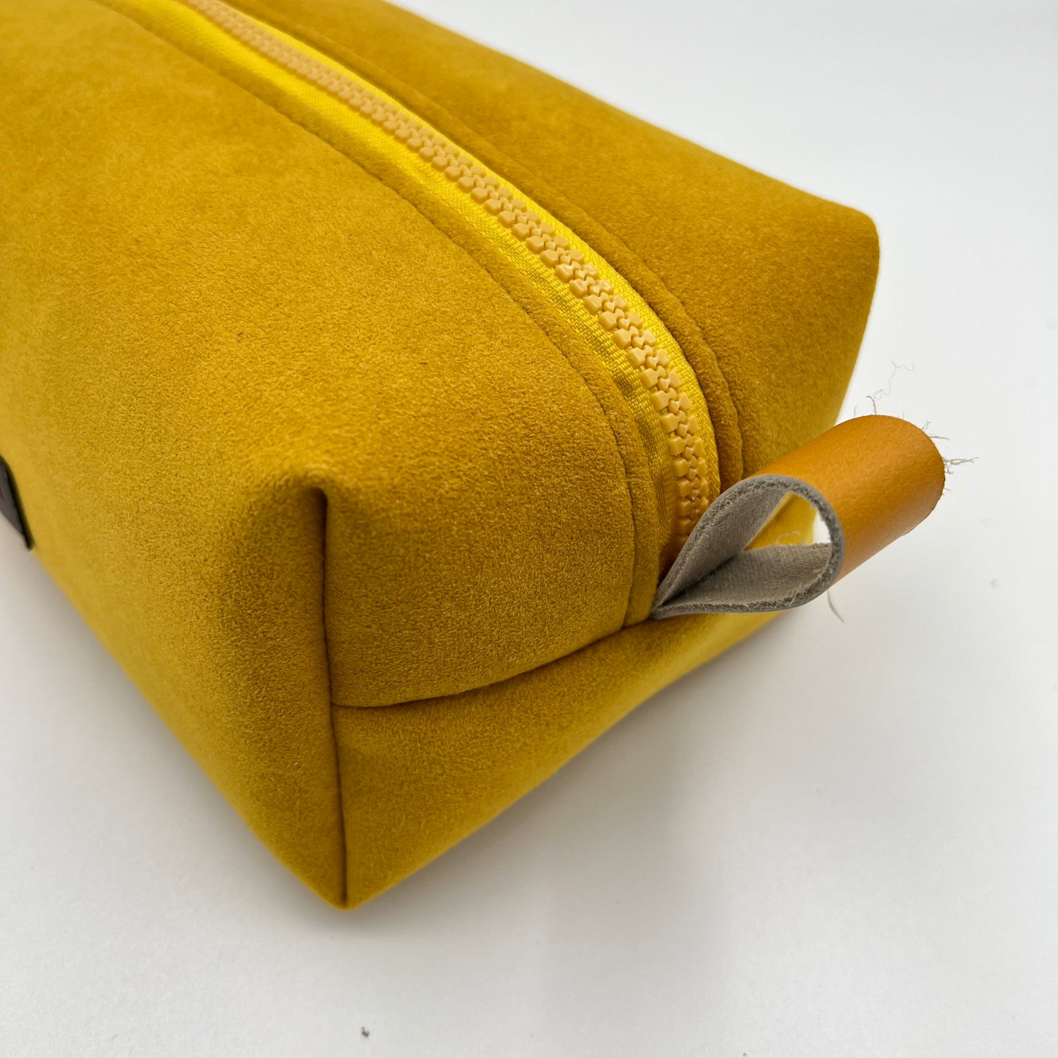 yellow alcantara toiletry bag