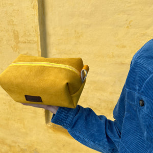 yellow alcantara toiletry bag